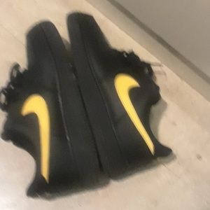 Black and gold Air Force Ones